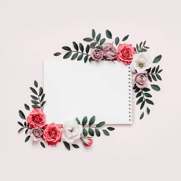 Notepad and floral frame in pastel colors. Spring Summer concept, boho style