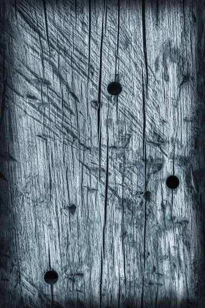 Old Knotted Wood Weathered Rotten Cracked Bleached And Stained Blue Vignetted Grunge Texture