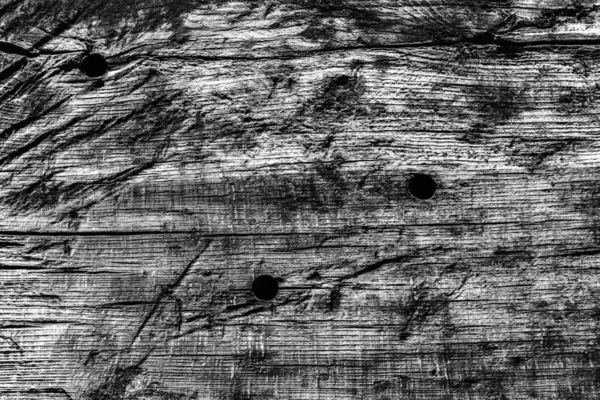 Antigua madera anudada envejecida podrida agrietada blanqueada y manchada textura grunge gris — Foto de Stock