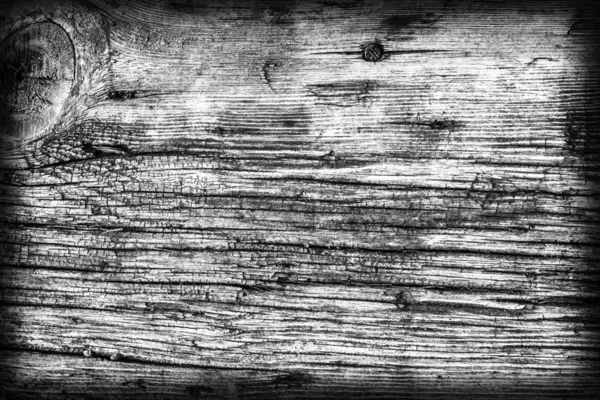 Παλιό κόμπους ξύλο, διαβρωμένες σάπια ραγισμένα λευκασμένα και βάφονται σκούρο γκρι vignetted σε Grunge υφή — Φωτογραφία Αρχείου