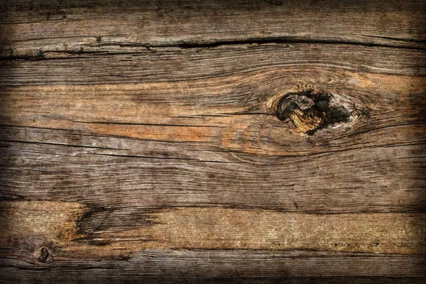 Altes geknotetes Holz verwittert morsch rissig vignettiert Grunge-Textur — Stockfoto