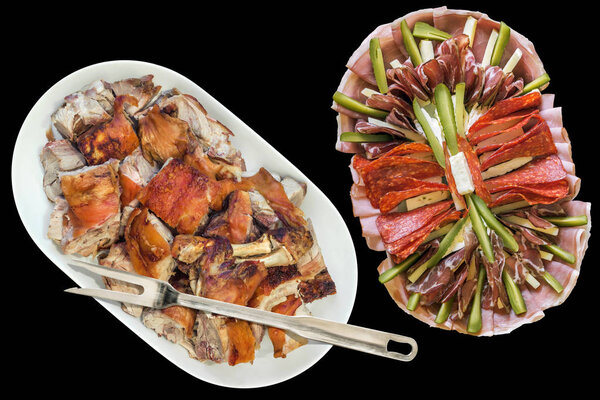Plateful of Spit Roasted Pork Shoulder Slices and Serbian Appetizer Savory Dish Meze Isolated on Black Background