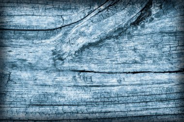 Eski yıpranmış çürük kırık düğümlü kaba ahşap toz mavi doku Vignetted