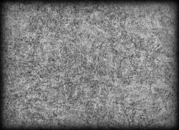 Grau gefärbt Recycling Wellpappe gebleicht meliert grob vignettiert Grunge-Textur — Stockfoto