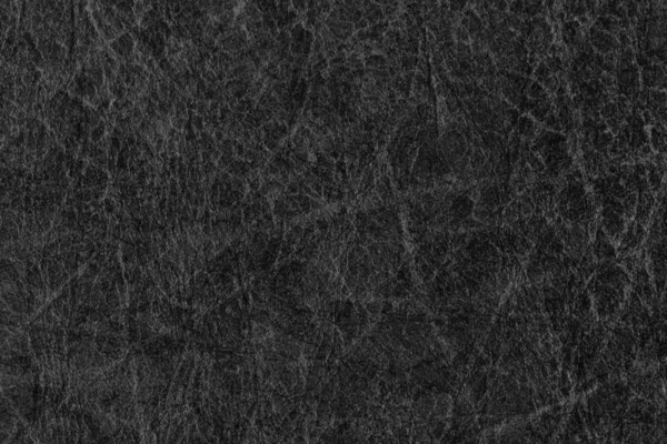 Старая черная кожа грубоватая, изуродованная измельченная текстура — стоковое фото