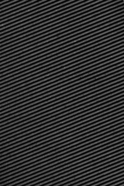 Утилизированный черный рифленый фибровый картон грубой текстуры фон — стоковое фото