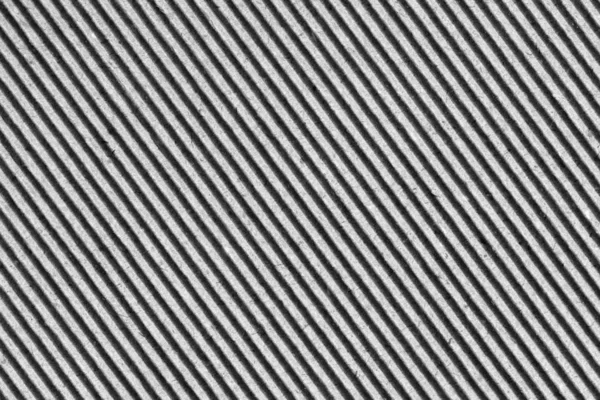 Утилизированный серый рифленый фибровый картон грубой текстуры фон — стоковое фото