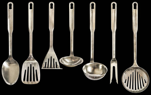 High Resolution Old Patinated Seven Pieces Stainless Steel Kitchen Utensils Set Isolated On Black Background