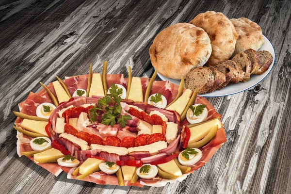 Traditional Appetizer Savory Dish Meze With Plate Of Leavened Pitta Flatbread Loaves And Integral Brown Baguette Slices Set On Old Weathered Lacquered Cracked Wooden Garden Table — Stock Photo, Image