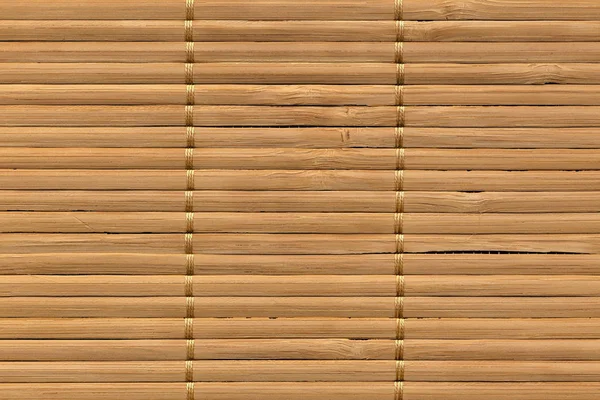 Сельский природный коричневый Slatted Bamboo Place Mat Переплетенный грубый зерна гранж текстуры — стоковое фото