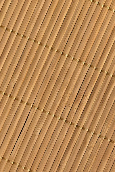 Сельский природный коричневый Slatted Bamboo Place Mat Переплетенный грубый зерна гранж текстуры — стоковое фото