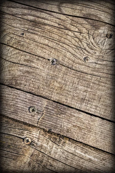Old Weathered Cracked Knotted Coarse Pine Wood Vignette Grunge Surface With Rusty Phillips Screws Embedded Detail — Stock Photo, Image