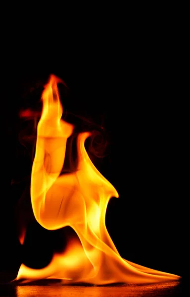 Beautiful fire flames on a black background. — Stock Photo, Image