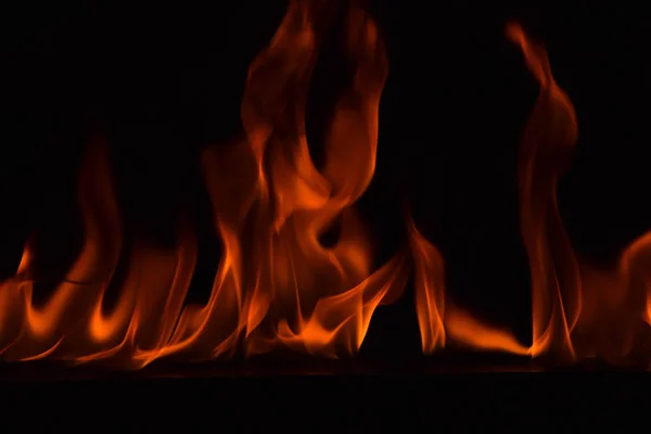 Fire flames on black background — Stock Photo, Image