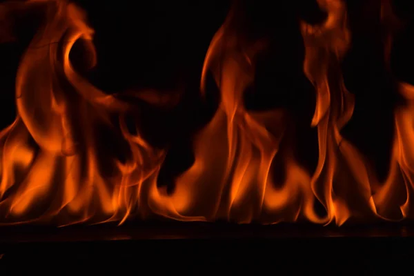 Fire flames on black background — Stock Photo, Image