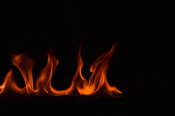 Fire flames on black background — Stock Photo, Image