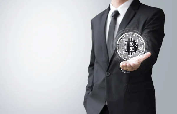 Business man present bitcoin — Stock Photo, Image