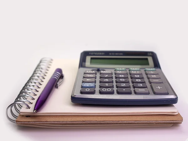 Business concept with notebook ,  pen and calculator — Stock Photo, Image