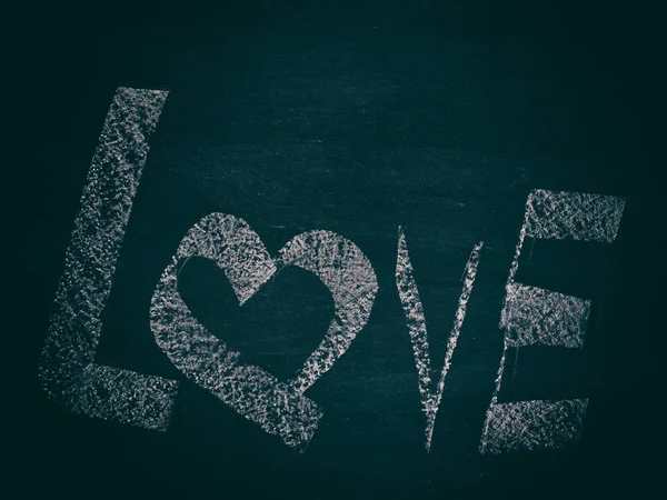 Love symbol on the blackboard.