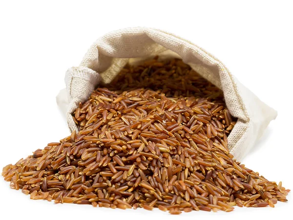 Natural brown rice in small burlap sack. — Stock Photo, Image