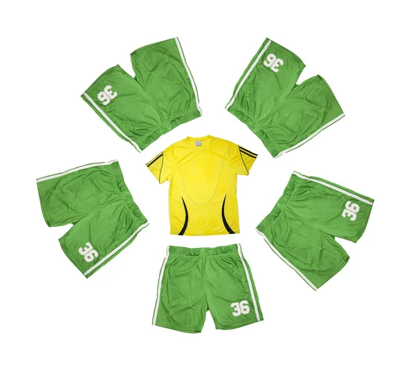 Yellow t-shirt and five green shorts — Stock Photo, Image