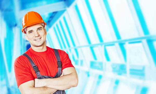 Retrato Obrero Overol Casco Sobre Fondo Interior Azul —  Fotos de Stock