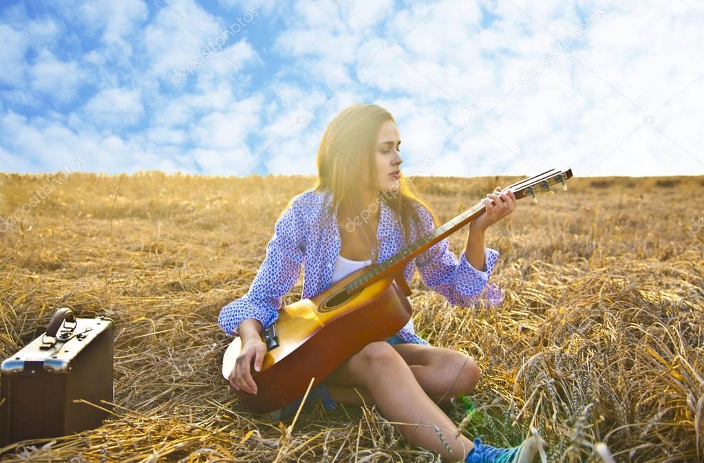 Woman chilling with accoustic guitar 