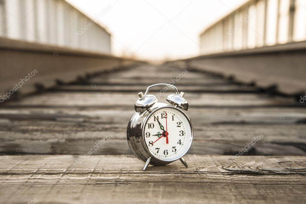 alarm clock between  rails 