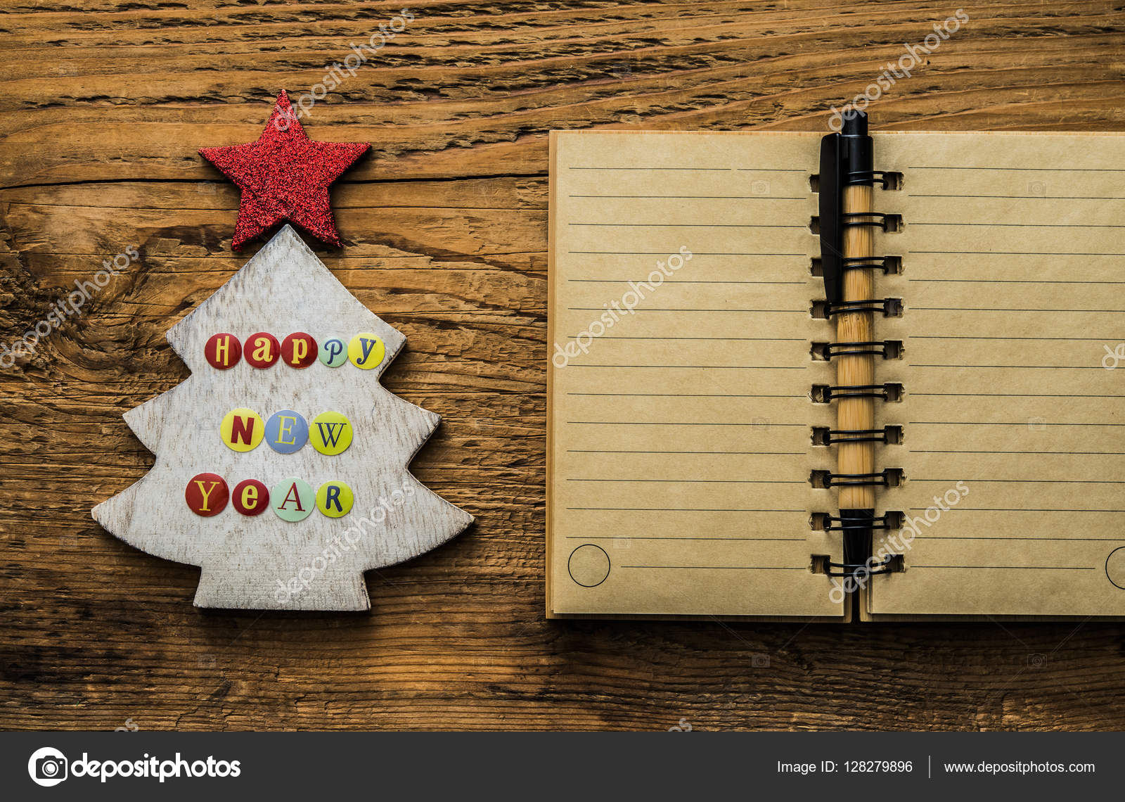 Christmas tree and open notepad Stock Photo by ©borjomi88 128279896