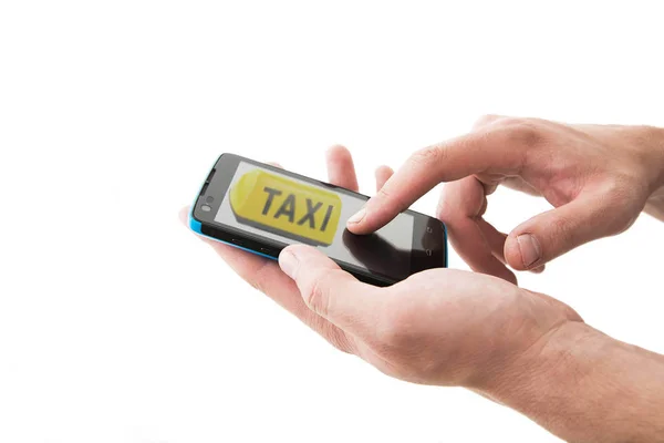 Hands holding smartphone with sign of taxi — Stock Photo, Image