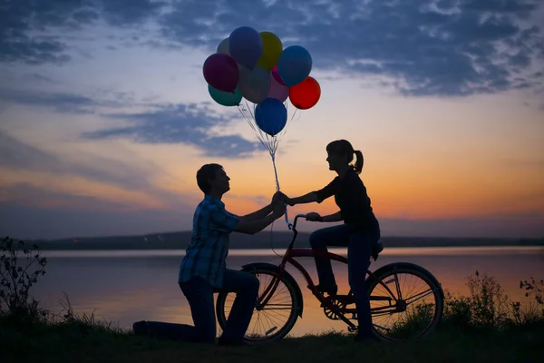 Silhouette Couple Man Bicycle Woman Holding Colorful Balloons Sunset Cloudy — Stock Photo, Image