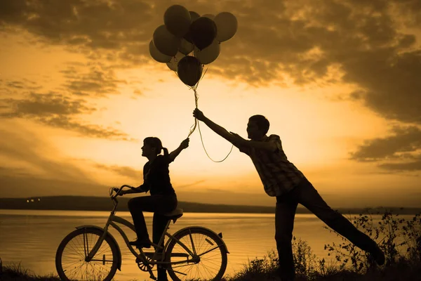 Silhouettes Two Beautiful Adult People Holding Balloons — Stock Photo, Image