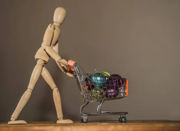 figure pushing  trolley with toys
