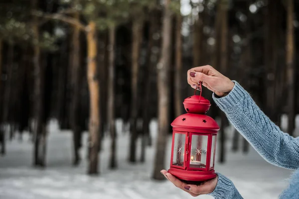 hands Holding red candle lantern