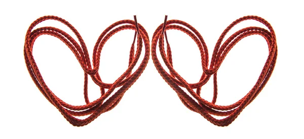 Dvě červené krajky nebo lana srdce — Stock fotografie