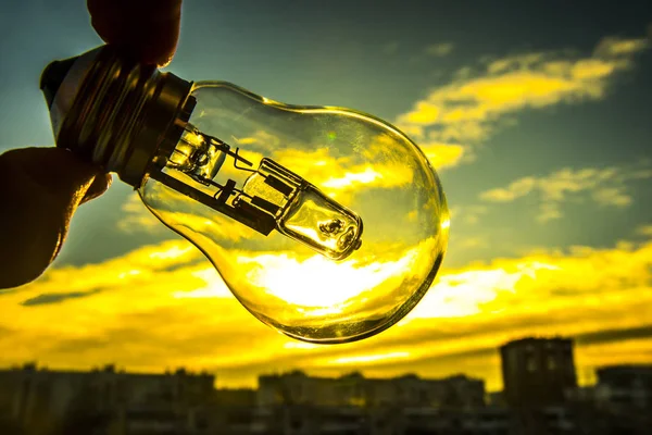 Light Bulb above Sunset background. — Stock Photo, Image