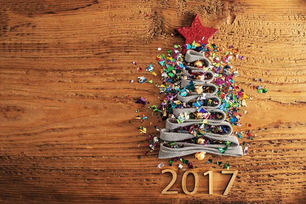 Christmas Tree from a lot colorful confetti — Stock Photo, Image