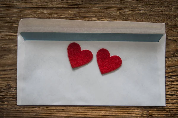 Hearts on white paper envelope — Stock Photo, Image