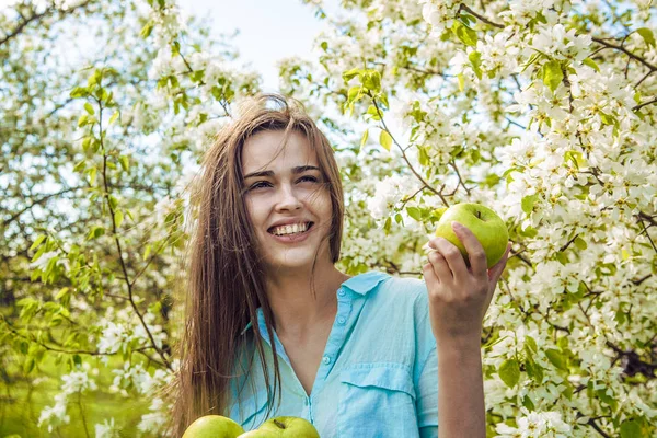 beautiful woman holding apples