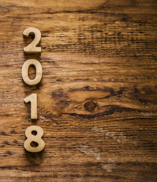 Nummer op houten tafel achtergrond. — Stockfoto