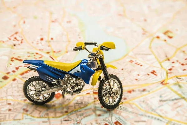 enduro motorcycle toy on map.