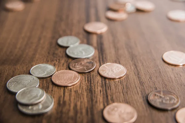 Cents  on old wooden table backgroun Royalty Free Stock Photos