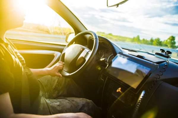 man in the car with tablet screen computer.