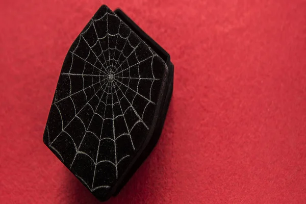 Cover of black coffin with spiderweb — Stock Photo, Image