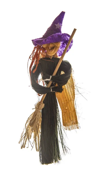 Toy witch with broom — Stock Photo, Image