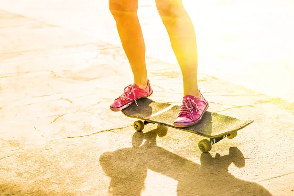 teen girl with long skate board.