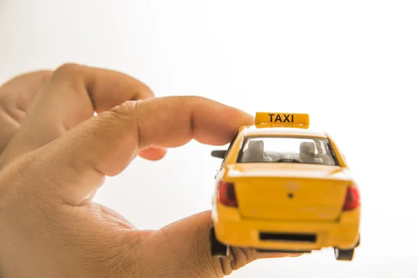 hand holding  taxi car model