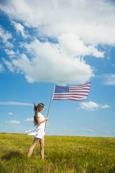 Girl  holding American flag — Stock Photo, Image