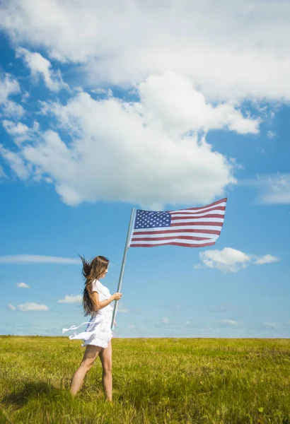 Girl  holding American flag — Stock Photo, Image