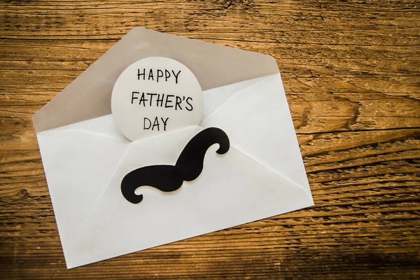 envelope with  black paper mustache